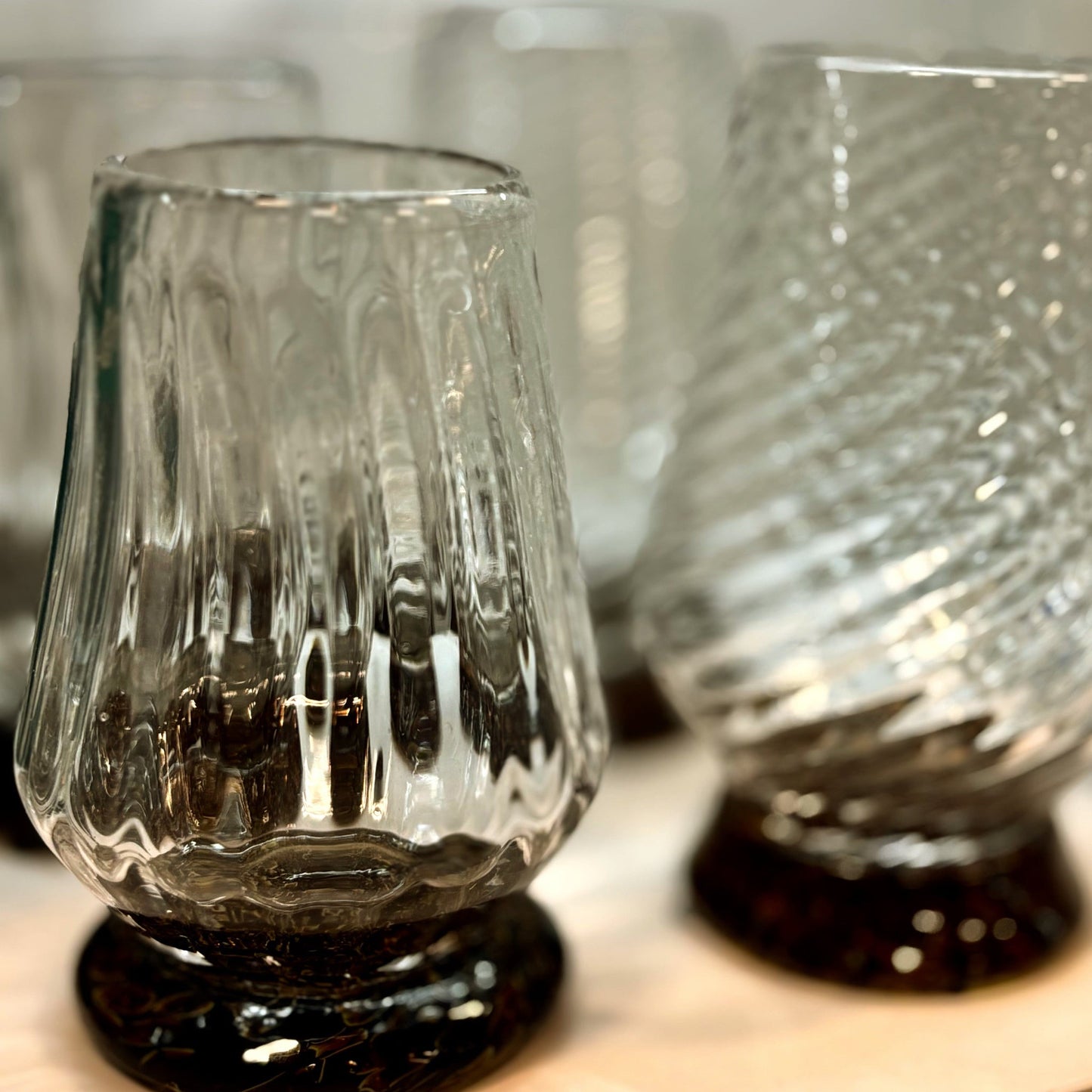 These exquisite glasses are hand-blown right here in the Pacific Northwest. Each of the three glasses is crafted using a unique mold, resulting in their distinct styles. Sold individually, you can assemble your own set.

The Hand-Blown Neat Pour Glass is meticulously crafted to amplify the aromatic notes of your selected spirit, ensuring an exquisite and immersive drinking experience. It is an ideal choice for a diverse range of beverages, including smooth scotch and aged tequila, as well as any other premi