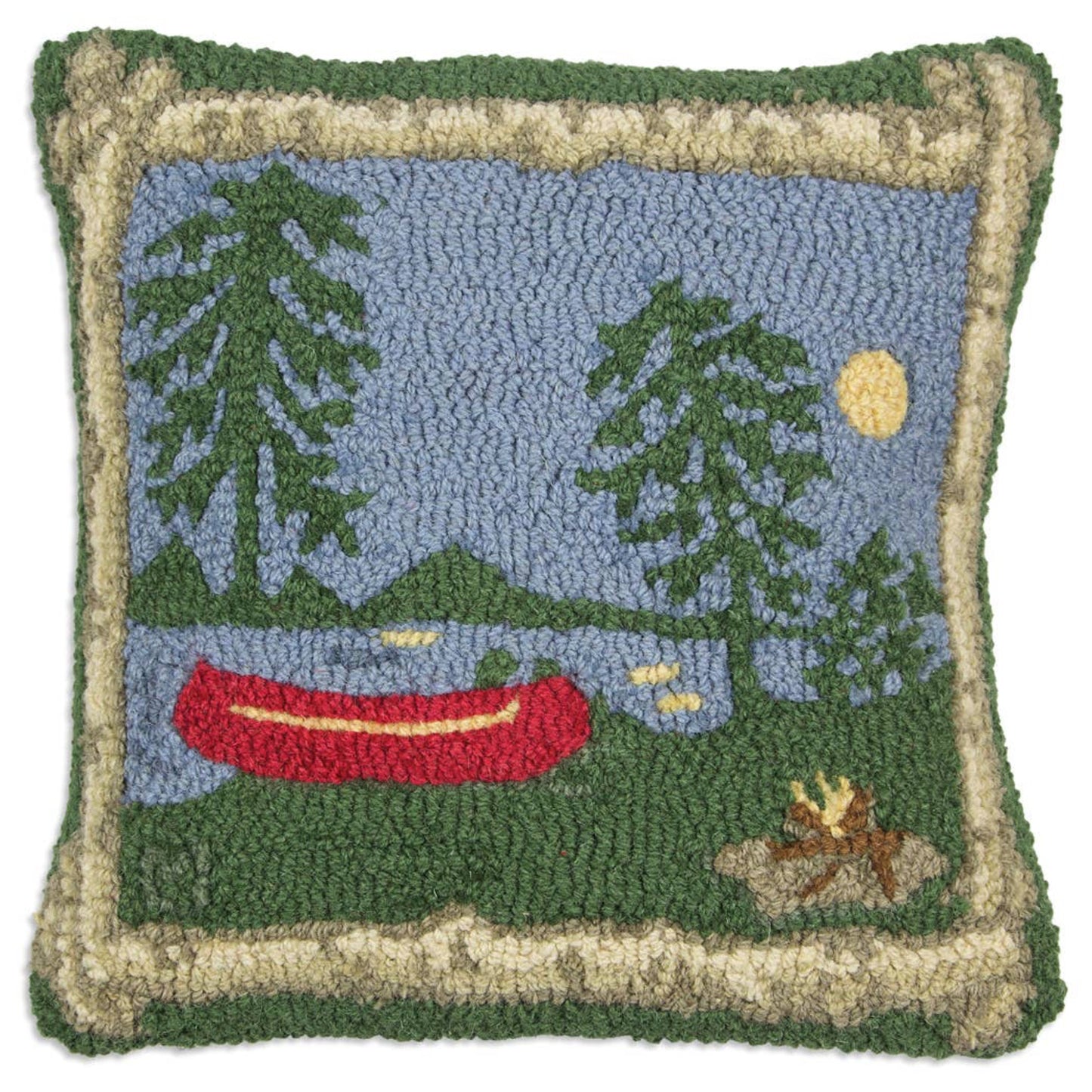 A hand hooked wool throw pillow with a campfire scene, featuring a red canoe, trees, and a blue sky.