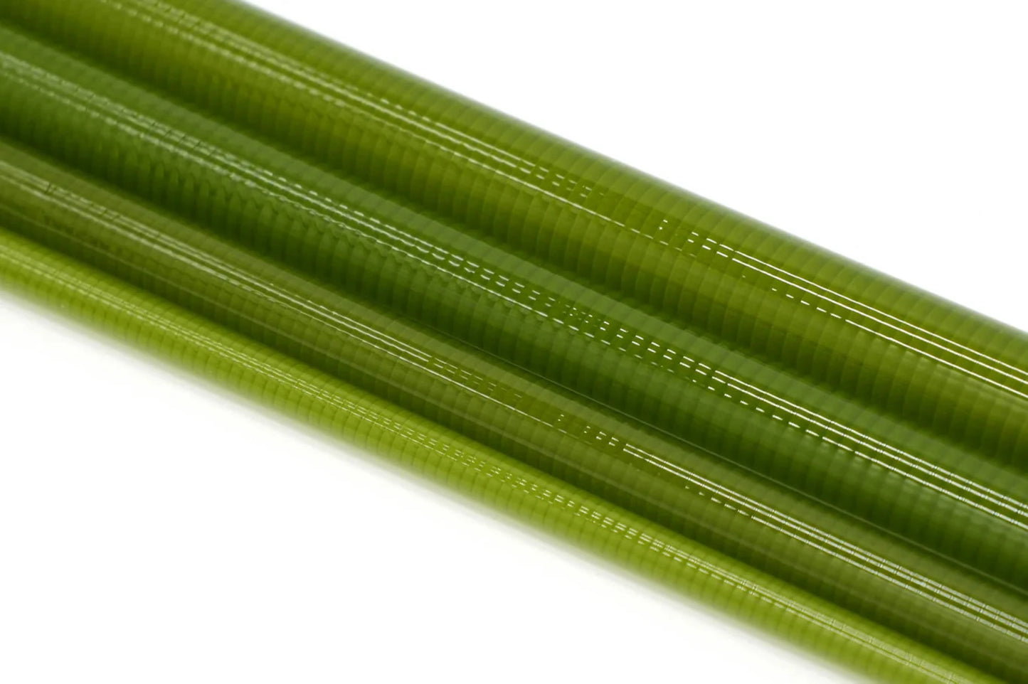 Three green ribbed tubes on a white background