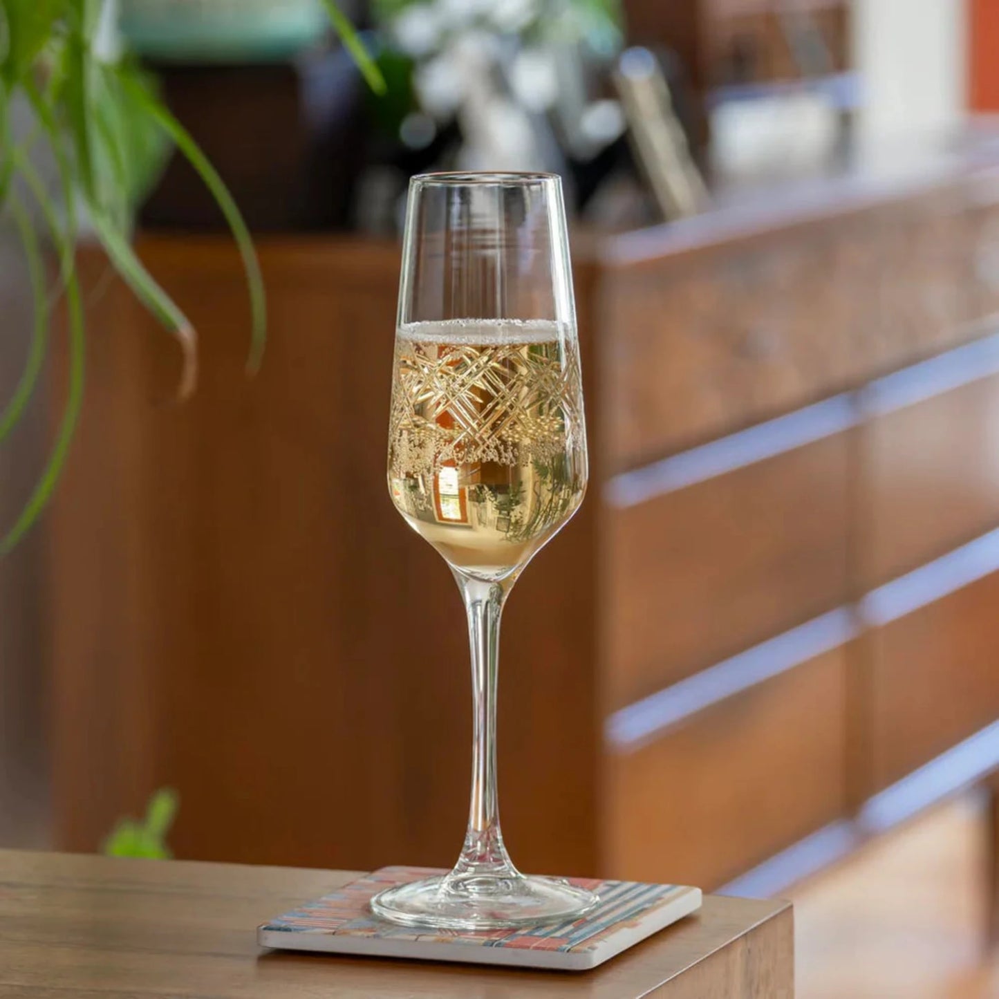 Experience the elegance of the Argyle 5.75oz Champagne Flute by Rolf Glass. Adorn by the classic diamond pattern, this flute is perfect for celebrating special occasions in style. Its timeless design and high-quality craftsmanship make it a must-have for any wine enthusiast. Whether you're toasting to a milestone or enjoying a quiet evening at home, this flute will elevate your drinking experience.