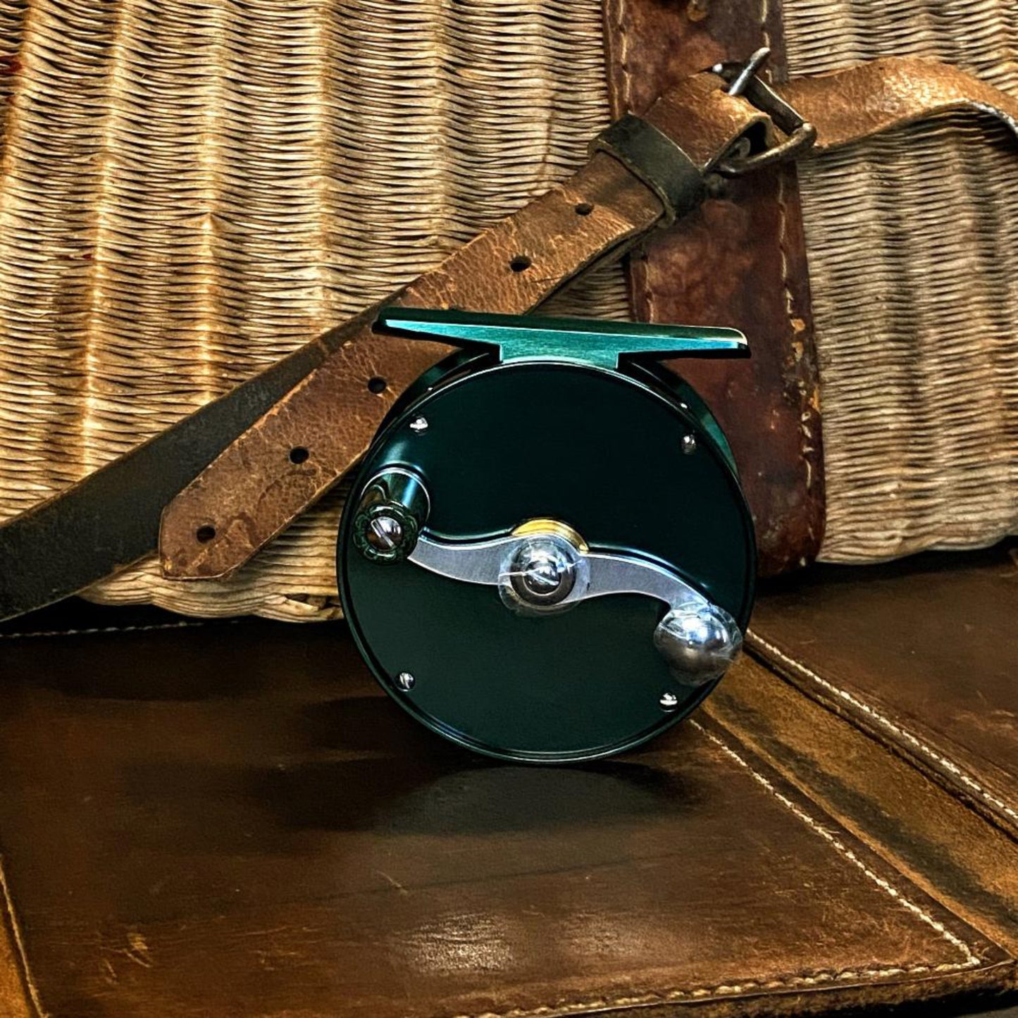 Close-up of Nikko Leaf Small Trout reel green and black ebonite knob with click and pawl drag