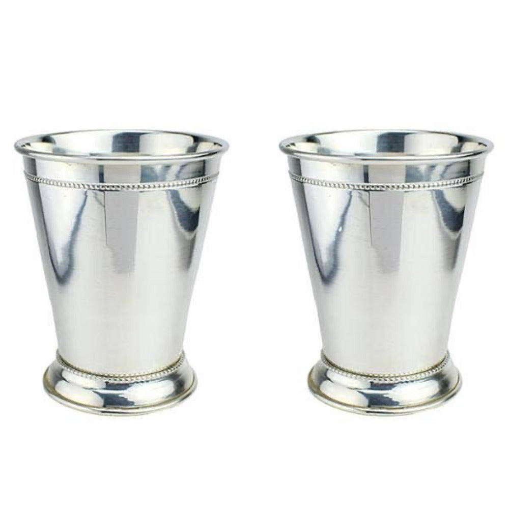 Experience the luxury of our Pure Copper Mint Julep Cup with Silver Plate. Crafted with precision, this cup is ideal for sipping cocktails or iced tea. Its beautiful design adds a touch of elegance to any setting, making it a perfect gift or party favor.

The copper material keeps your drinks chilled, while the silver plate adds a sophisticated touch. Enjoy the refreshing taste of your favorite beverage in style with this premium quality cup.

Heirloom Quality. Pure Copper with Silver-plate Set of 2 in Prem