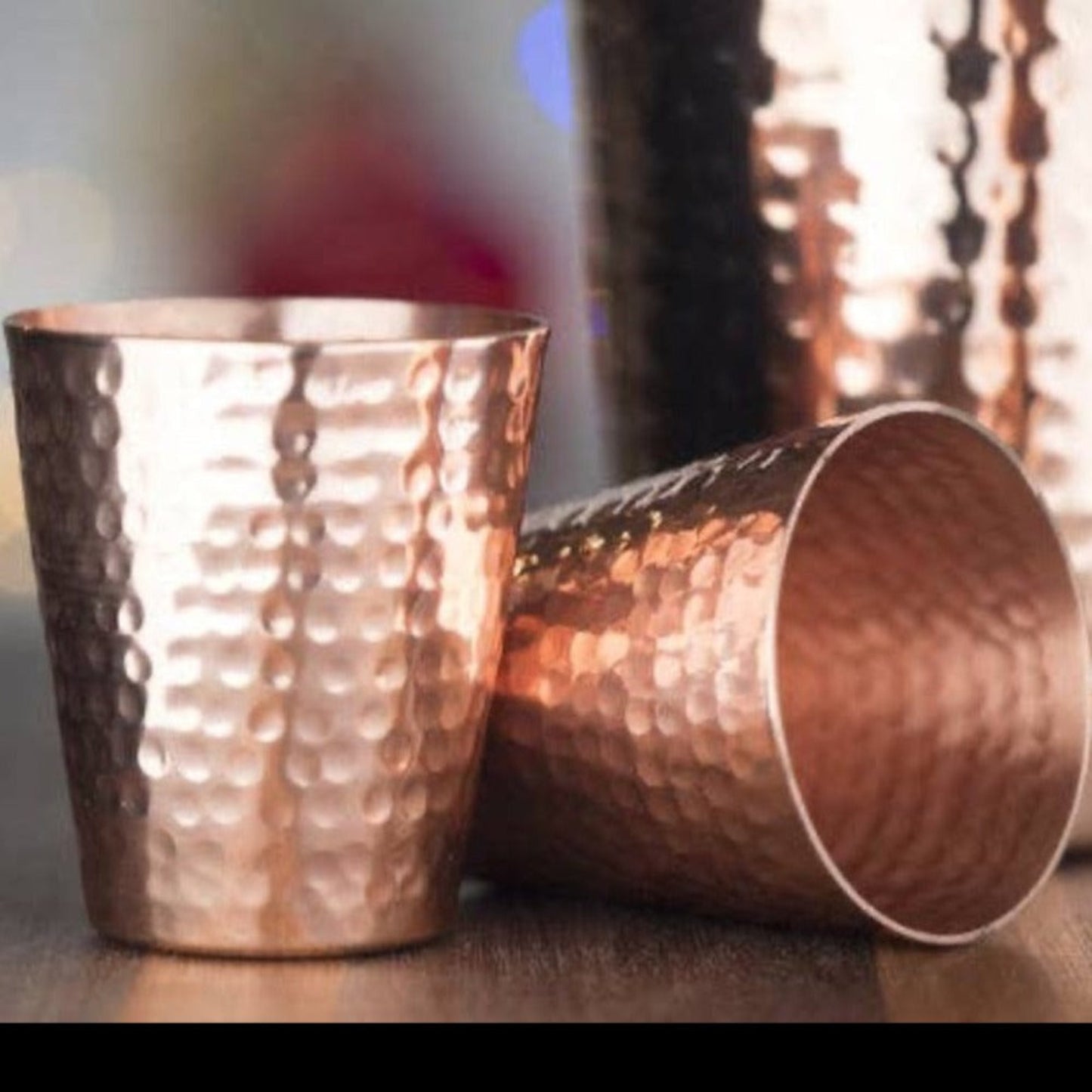 Experience the luxury of our Hammered Copper Shot Glasses. Handcrafted with 100% pure solid copper, these shot glasses provide an elegant touch to your drinking experience. The mirror plate finish with a lacquer coating adds a touch of class to your bar setup. Whether you're mixing drinks, serving chilled shots, or sipping tequila, these shot glasses enhance the flavor profile of your beverages. Each set comes with two shot glasses, each holding 2 1/2 ounces, perfect for sharing or enjoying a double shot.