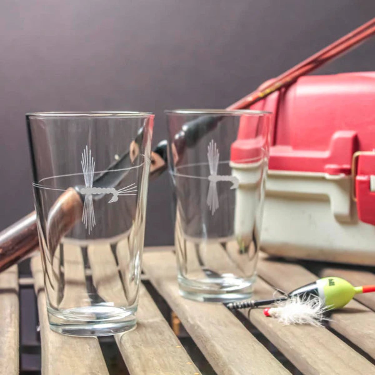 Experience the thrill of fly-fishing with our Rolf Glass Fly Fishing 16oz Beer Pint Glass. Perfect for outdoorsmen and nature enthusiasts. Shop now!